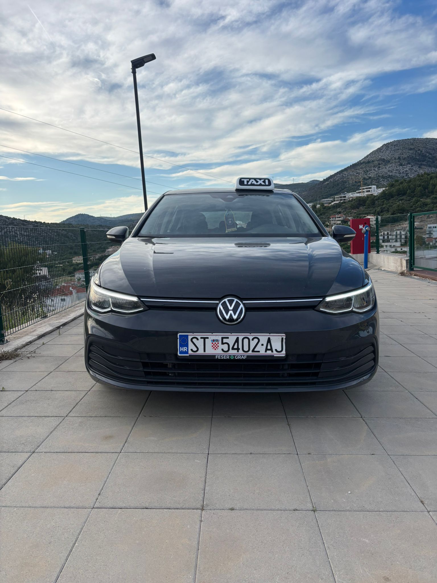 Taxi Mediteraneo Volkswagen Golf 8 taxi parked above Trogir, Dalmatia